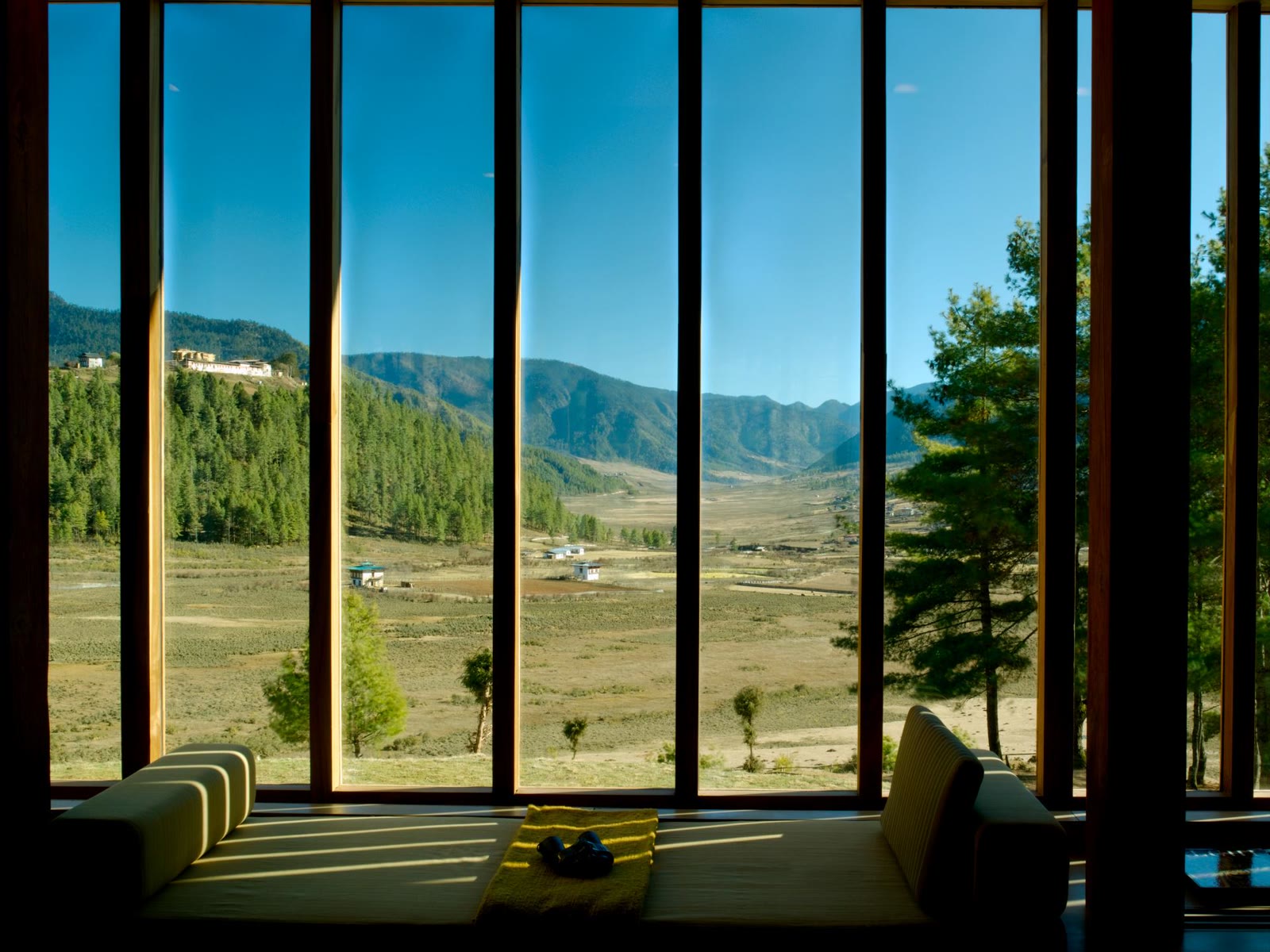 A suite living room with valley views at Amankora Gangtey, Bhutan