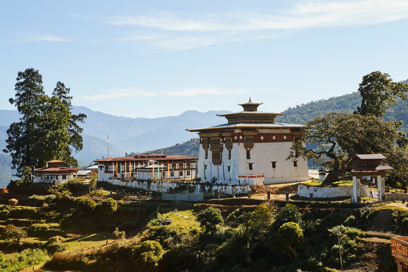 A monastery above the rice fields of the Punakha Valley, Bhutan