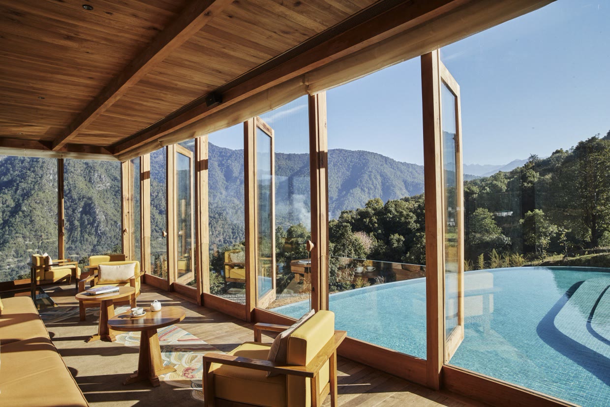 The Flying Farmhouse interior with pool view at Six Senses Punakha, Bhutan