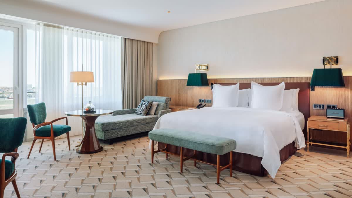 A park-view suite bedroom at the Four Seasons Hotel Ritz Lisbon