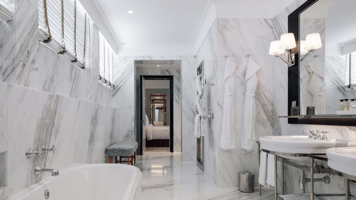 The marble bathroom of a suite at the Four Seasons Ritz Lisbon