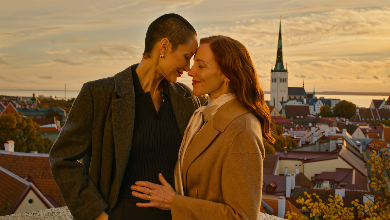 A couple above the rooftops of Tallinn at sunset