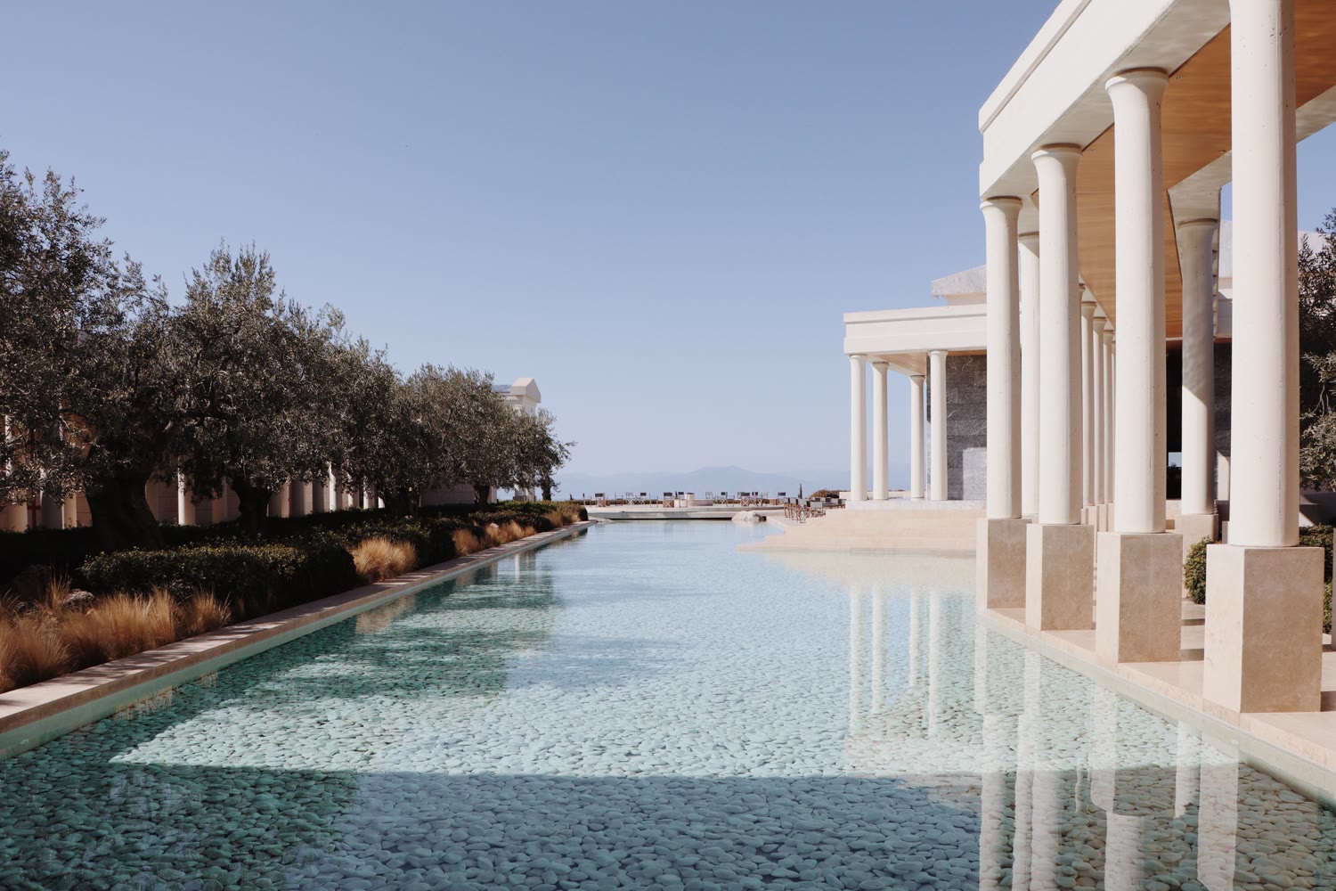 The colonnaded reflection pool at Amanzoe, looking to the Aegean