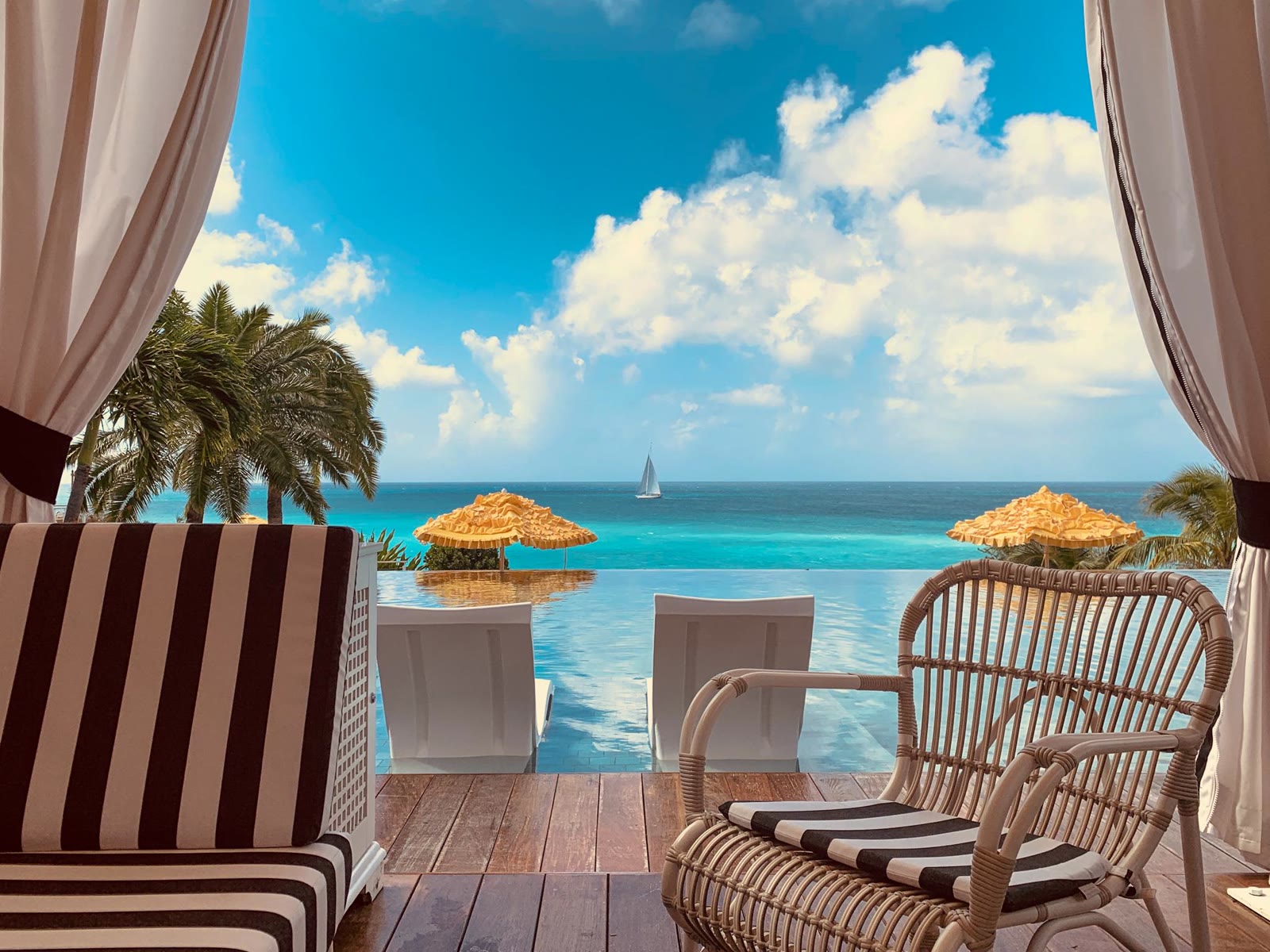 A pool cabana and ocean view at Malliouhana, Anguilla