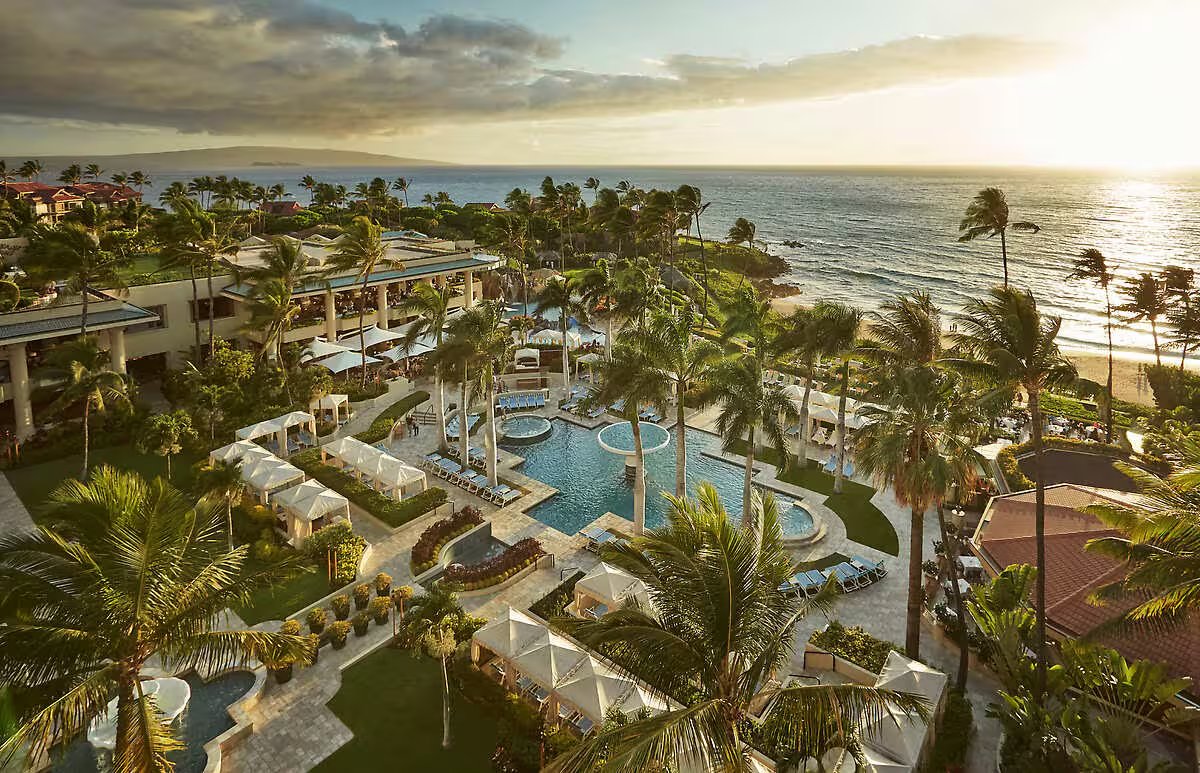 Four Seasons Resort Maui at Wailea aerial view of beachfront pool complex at sunset