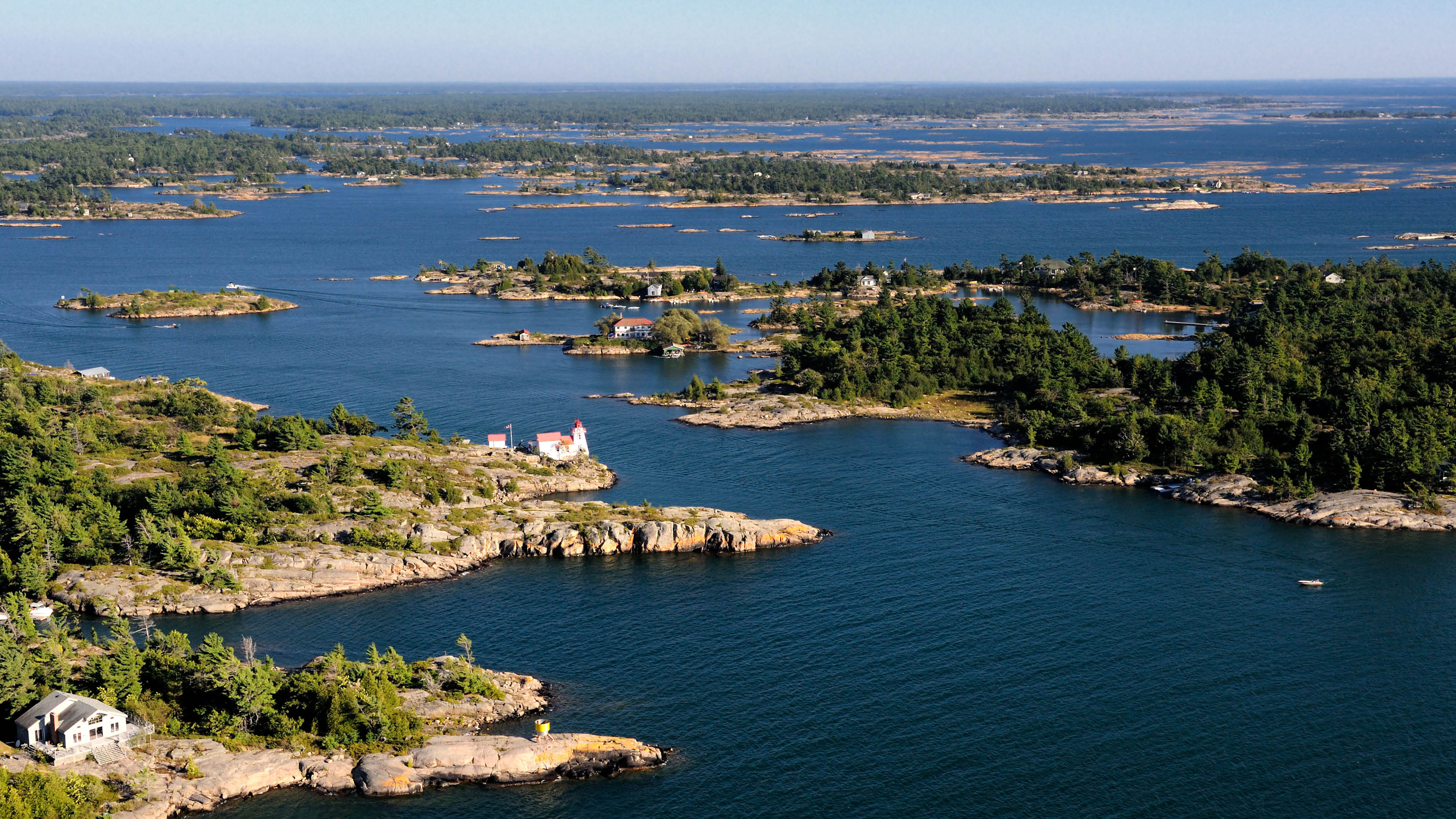 Aerial view of Georgian Bay on Lake Huron, rocky islands and lighthouse
