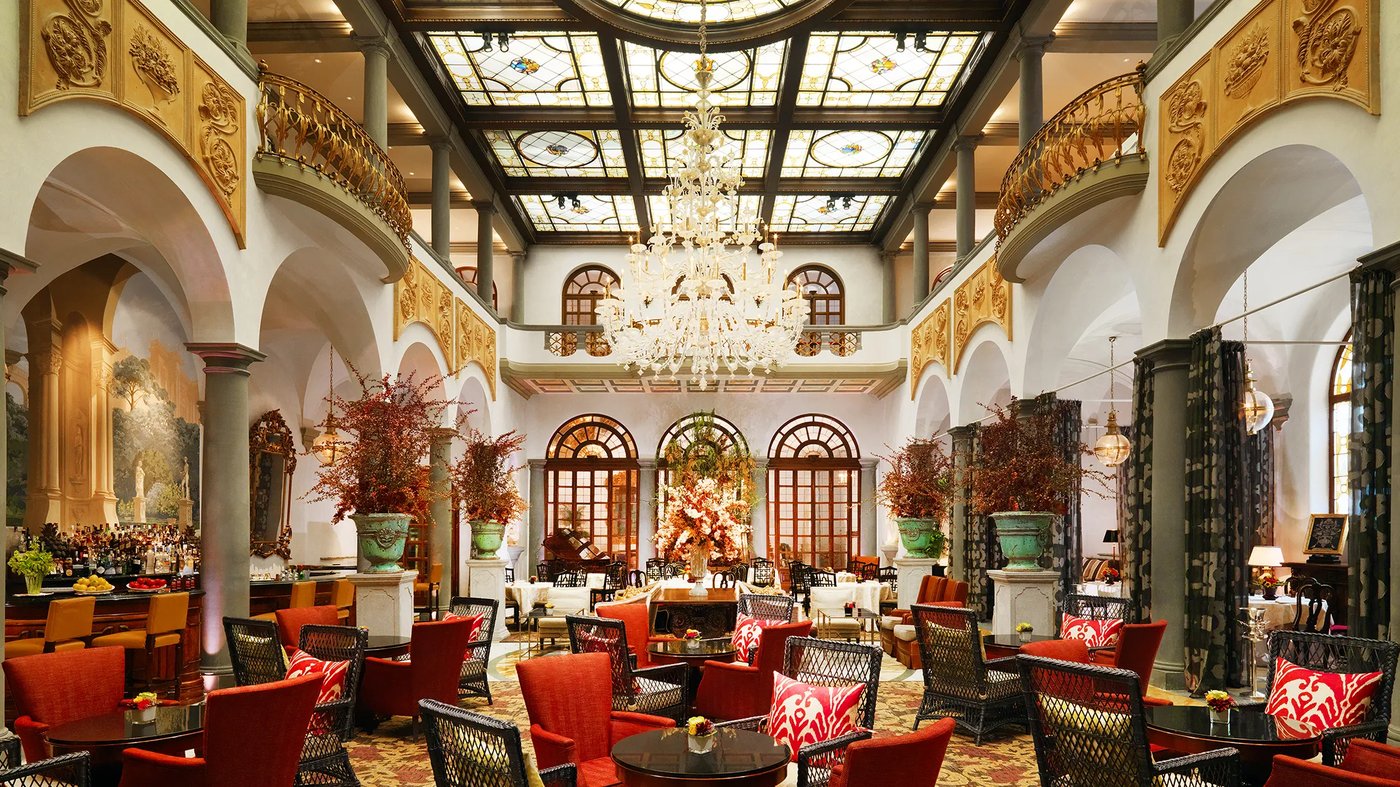 The St. Regis Florence Winter Garden with stained glass ceiling and Florentine decor