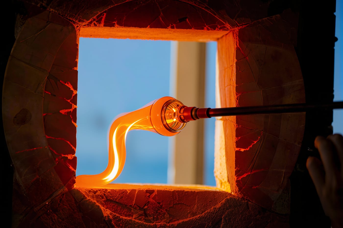 Molten glass on a blowpipe in a Murano furnace