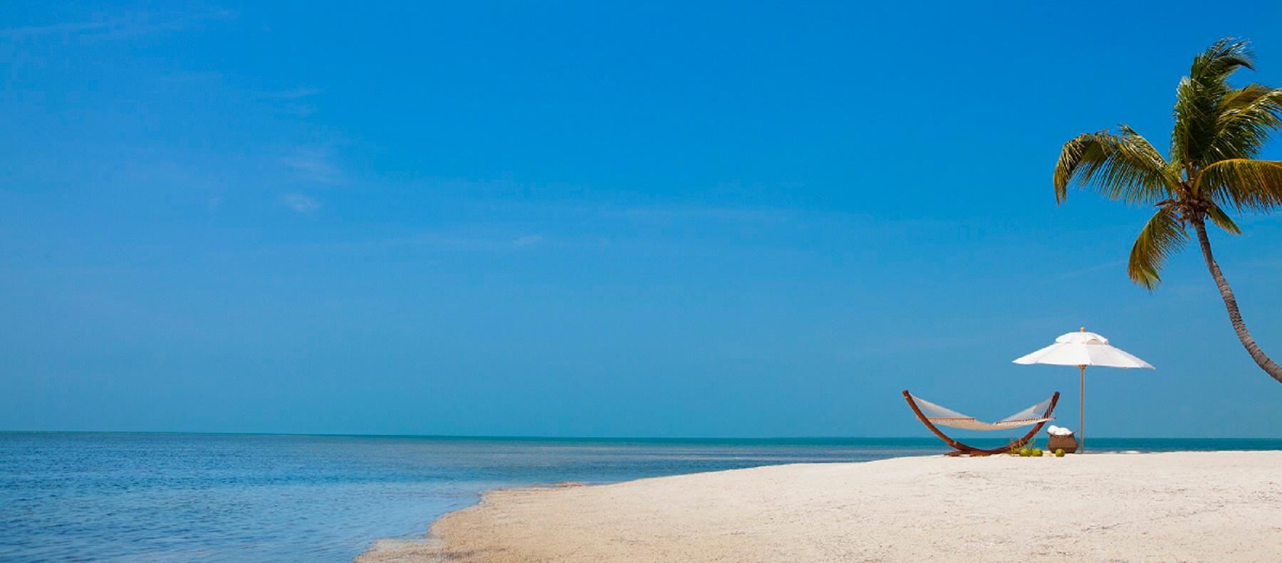 The private beach and lagoon at Little Palm Island Resort & Spa