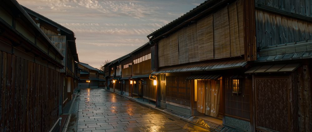A lantern-lit cobbled lane in the Gion geisha district at dusk, Kyoto