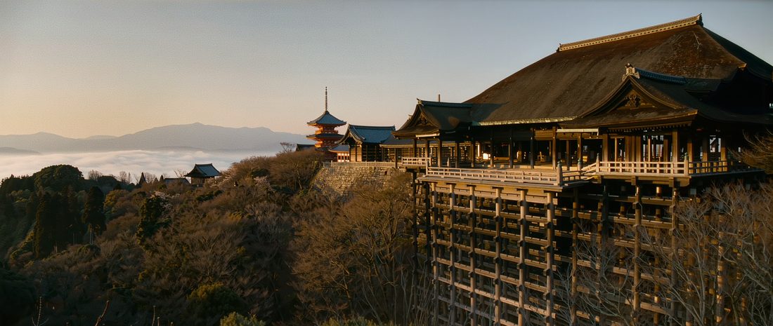 The wooden terrace of Kiyomizu-dera above the Higashiyama hillside at dawn, Kyoto