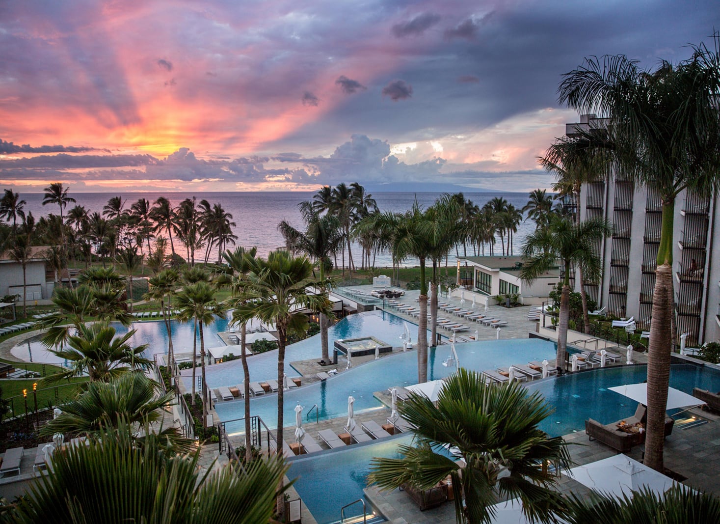 The tiered infinity pools at Andaz Maui at sunset