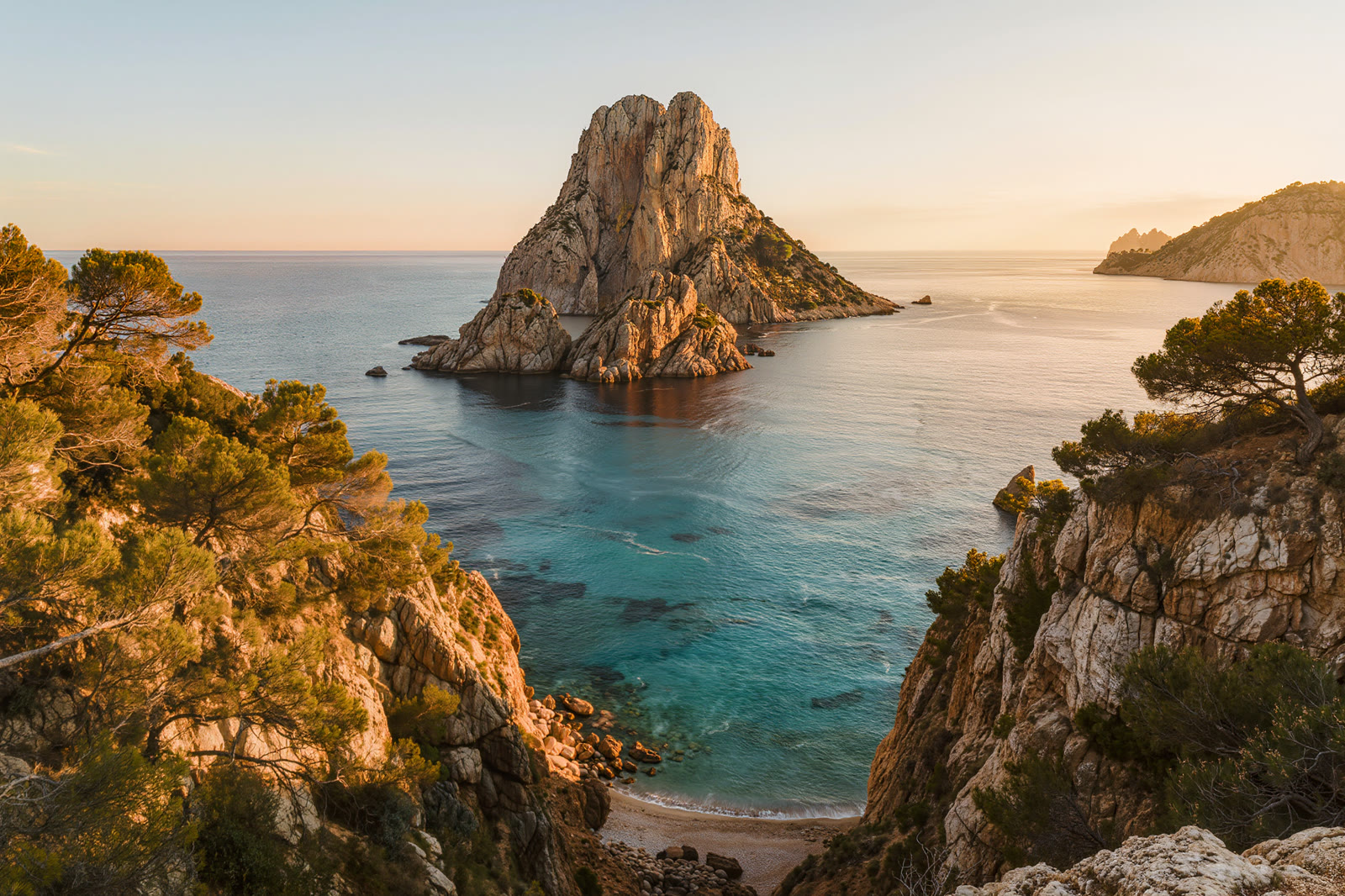 The cliffs and the rock of Es Vedra off the coast of Ibiza at golden hour