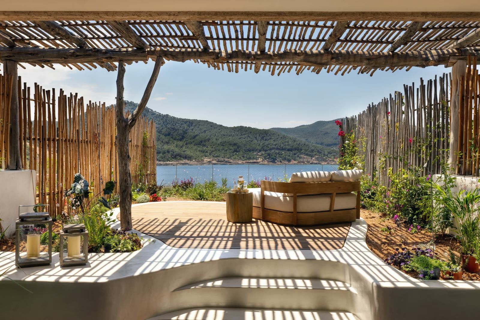 A Sea View Premium Junior Suite terrace over Xarraca Bay at Six Senses Ibiza