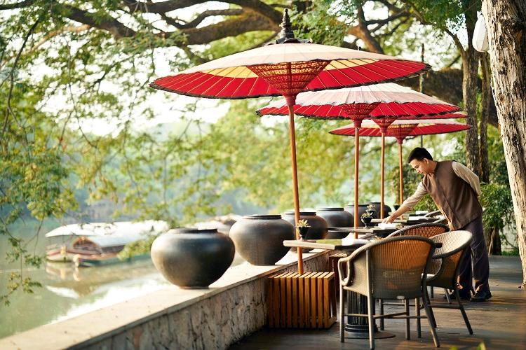 The riverfront dining deck at Anantara Chiang Mai