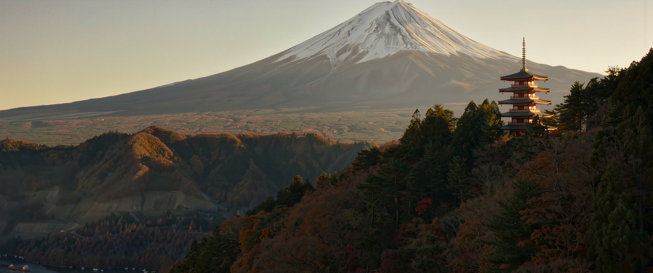 Mount Fuji rising behind a five-story pagoda